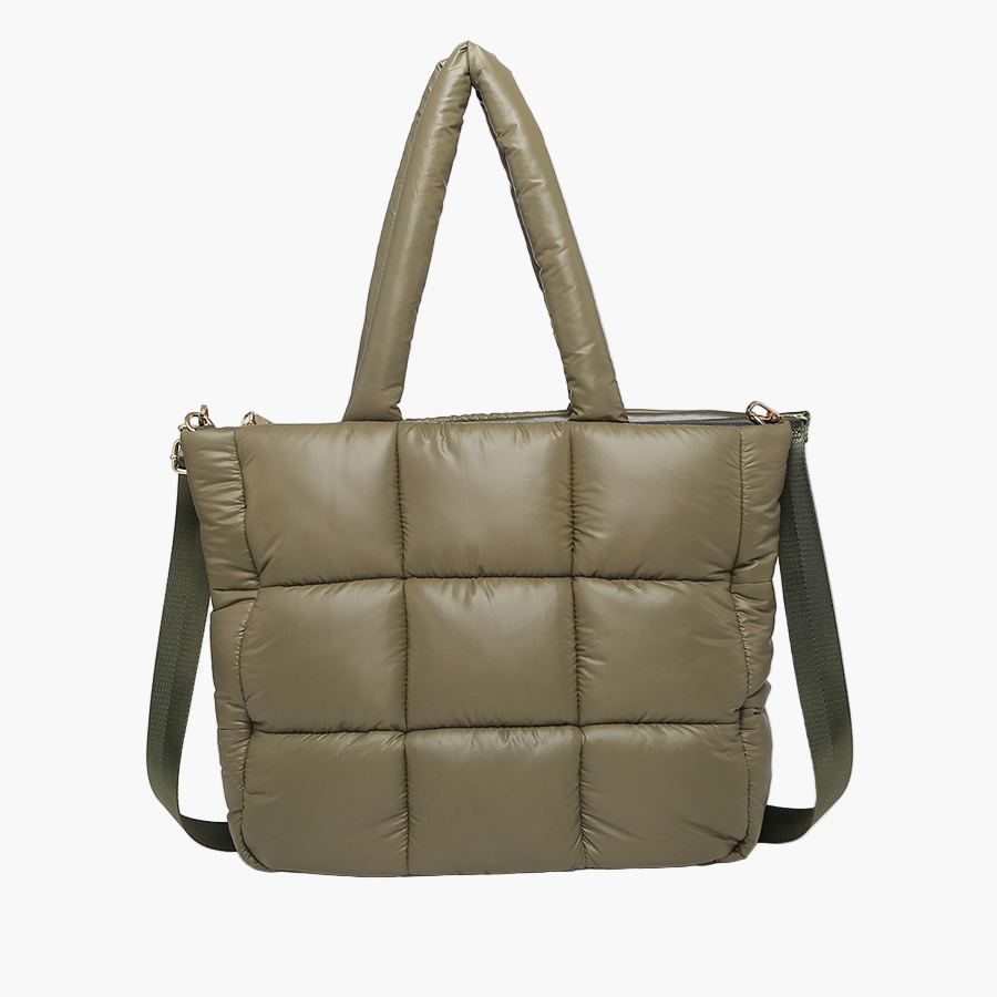 Green quilted handbag with a shoulder strap on a white background